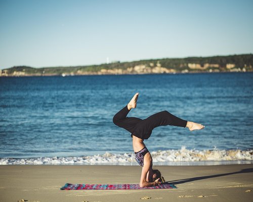 person doing yoga outdoors in garden